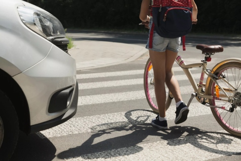 Car about to hit pedestrian with bicycle